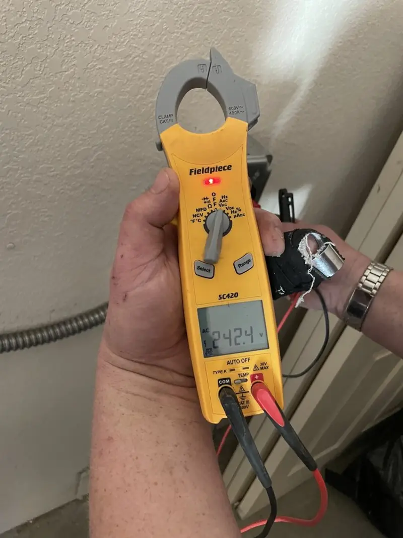 Voltage testing with clamp meter during Electrical Installation Services in Portland
